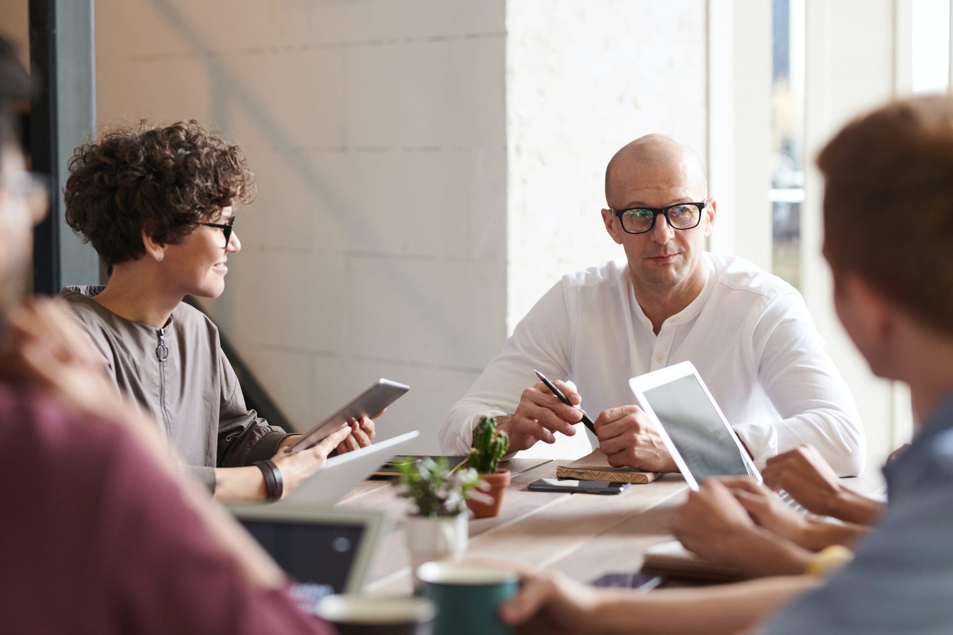 A team gathered around a table mid-discussion